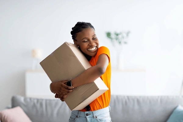 A happy customer receiving a product with a smile.